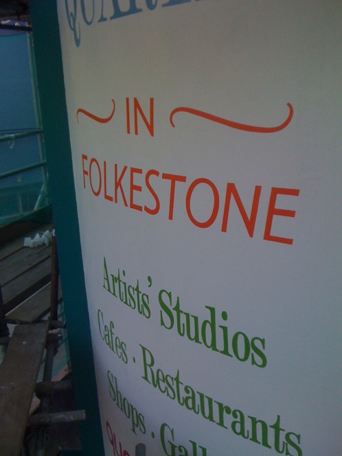 Sign painted on a rendered wall