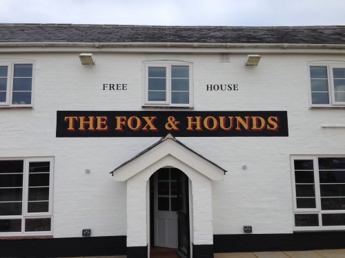 Pub sign painted direct onto the external wall of the Fox and Hounds in Denmead, Hants
