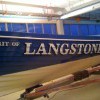 Hand painted traditional signwriting on a Victorian wooden rowing gig boat