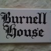 Hand lettered house sign with old english lettering
