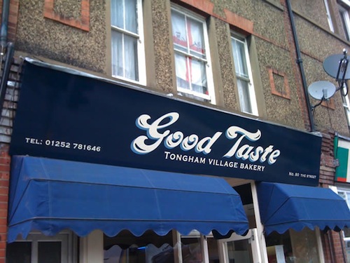 Fascia sign for Good Taste bakery in Tongham, Surrey