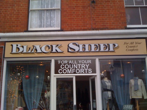 Hand painted shop fascia with block and cast shadows