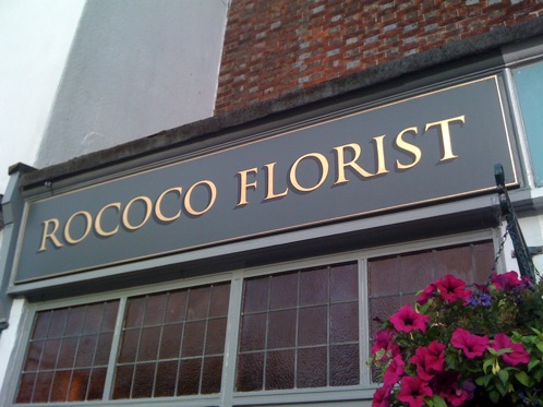 Gold leaf signboard with dark shade at Rococco Florists Chichester