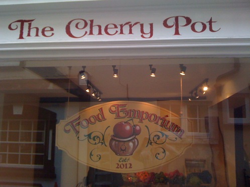 Hand painted signs above and inside this traditional Greengrocers store