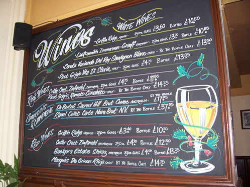 Hand written pub chalkboard