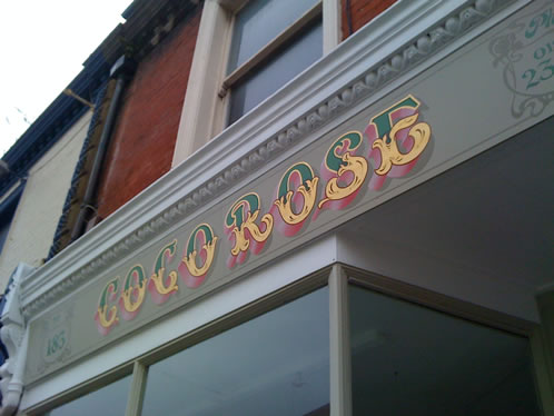 Victorian shop sign with gold leaf and paint effects