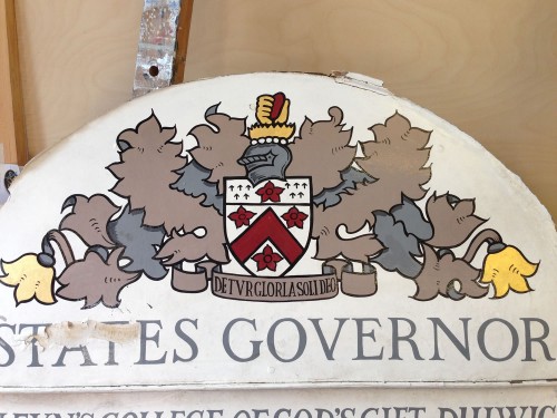 The original sign written crest on the Dulwich College toll gate sign