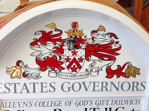 Detail of the new sign written crest on the Dulwich College Estate toll gate sign