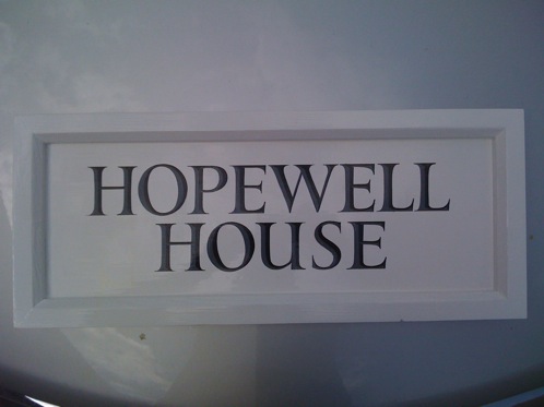 Handmade and painted timber house name sign