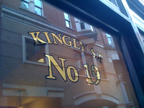 23 carat Gold leaf gilding on a glass door in London