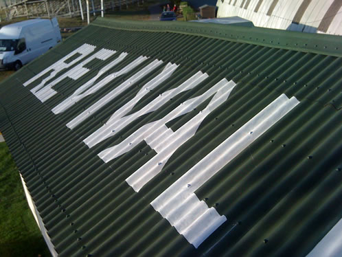 Hand Painted Lettering onto Corrogated Roof