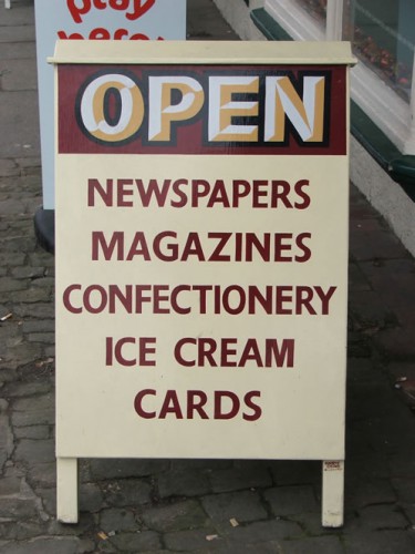 Handmade and painted newsagent sandwich sign