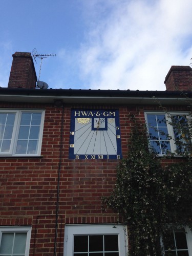 The completed hand painted sundial in situ on the wall of a Sussex house