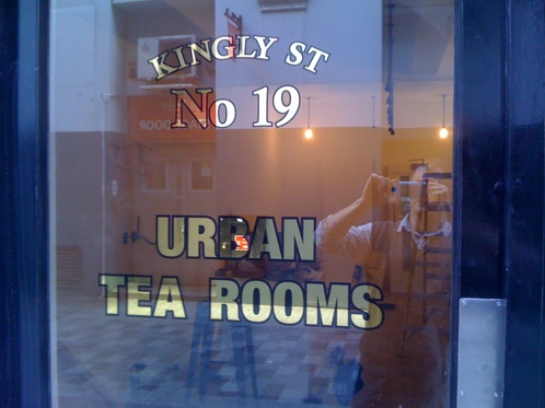 23 carat Gold leaf gilding on a glass door at Urban Tea Rooms, London, give a vintage feel