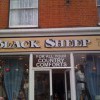 Hand painted shop fascia with block and cast shadows