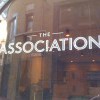 Glass signwriting at Association Coffee in London