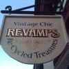 Gold leaf lettering on a shop swinging hanging sign