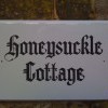 Hand painted timber house sign in Old English style painted  lettering