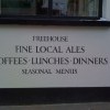 Hand signwritten lettering announce the wares of this traditional pub wall to passers by