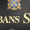 Hand painted Heraldic Crest signwritten on a Schools honours board for St Albans School