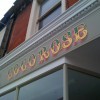 Victorian shop sign with gold leaf and paint effects