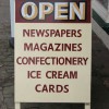 Handmade and painted newsagent sandwich sign