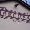 Large sign hand painted directly to a pub brick wall