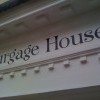 Traditionally hand signwriting on a door portico