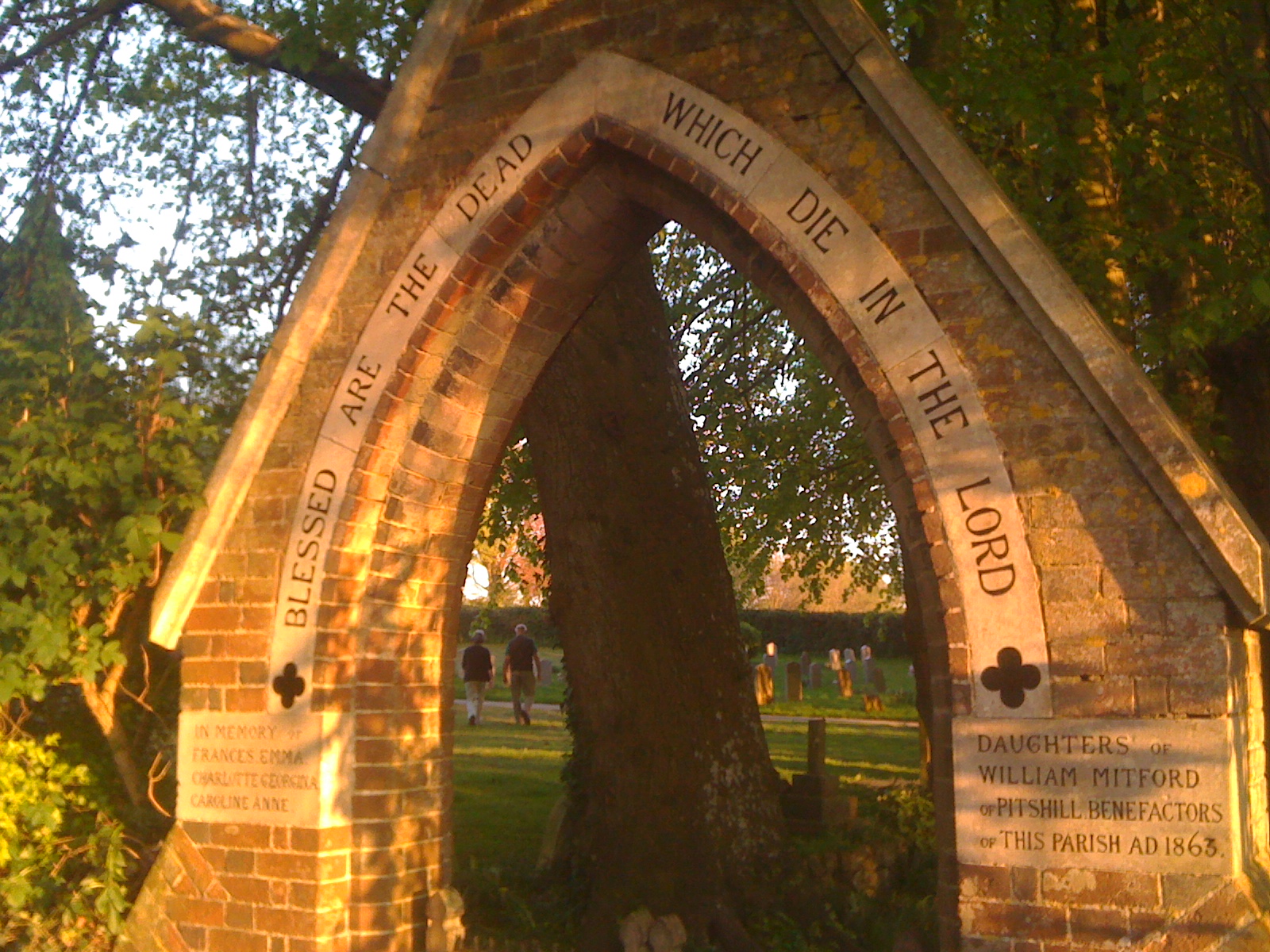 Restored stone archway with hand painted lettering